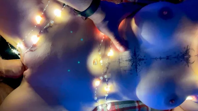 Dirty Lady fucks hard under the Christmas tree with her huge tits bouncing